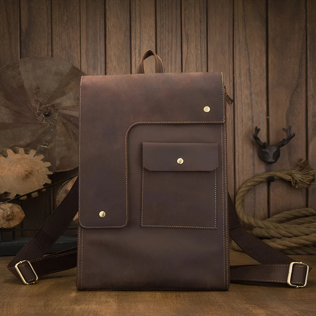 Dark brown genuine leather men's travel bag with shoulder straps and vertical square shape