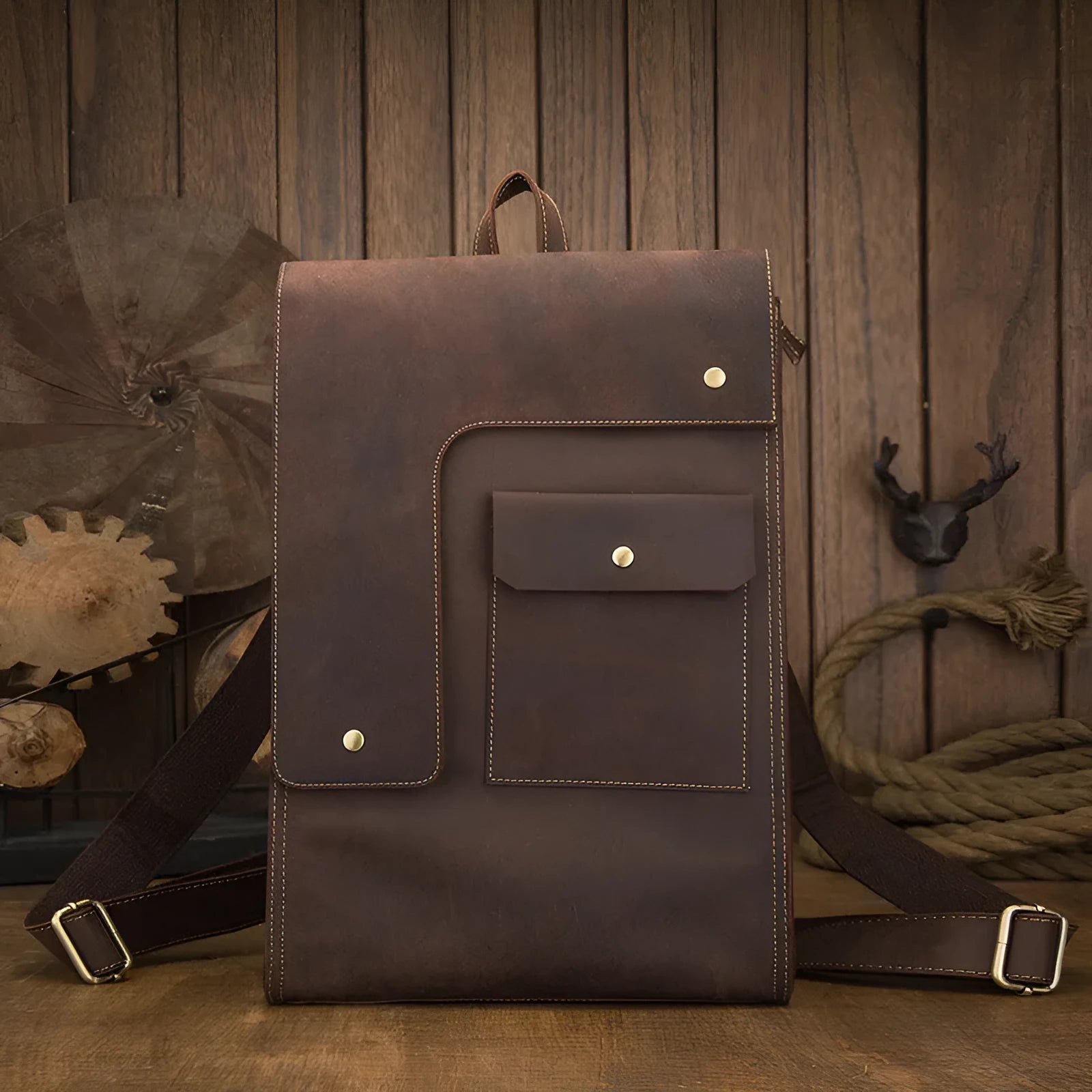 Dark brown genuine leather men's travel bag with shoulder straps and vertical square shape
