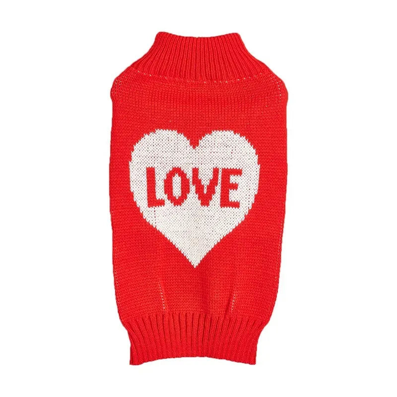 Red dog jumper with a white love heart and bow design on a small dog.