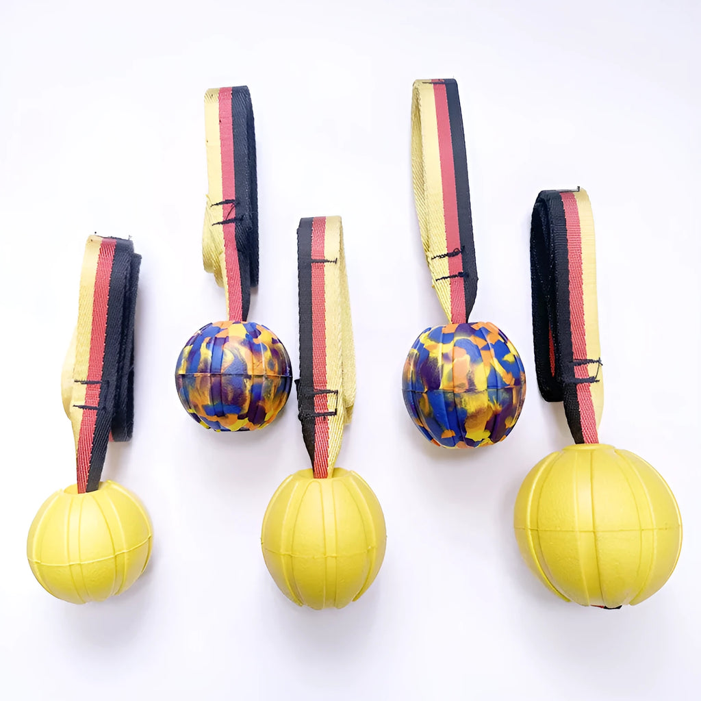 Yellow and camouflage EVA foam floating dog tetherballs in three different sizes for water fetch
