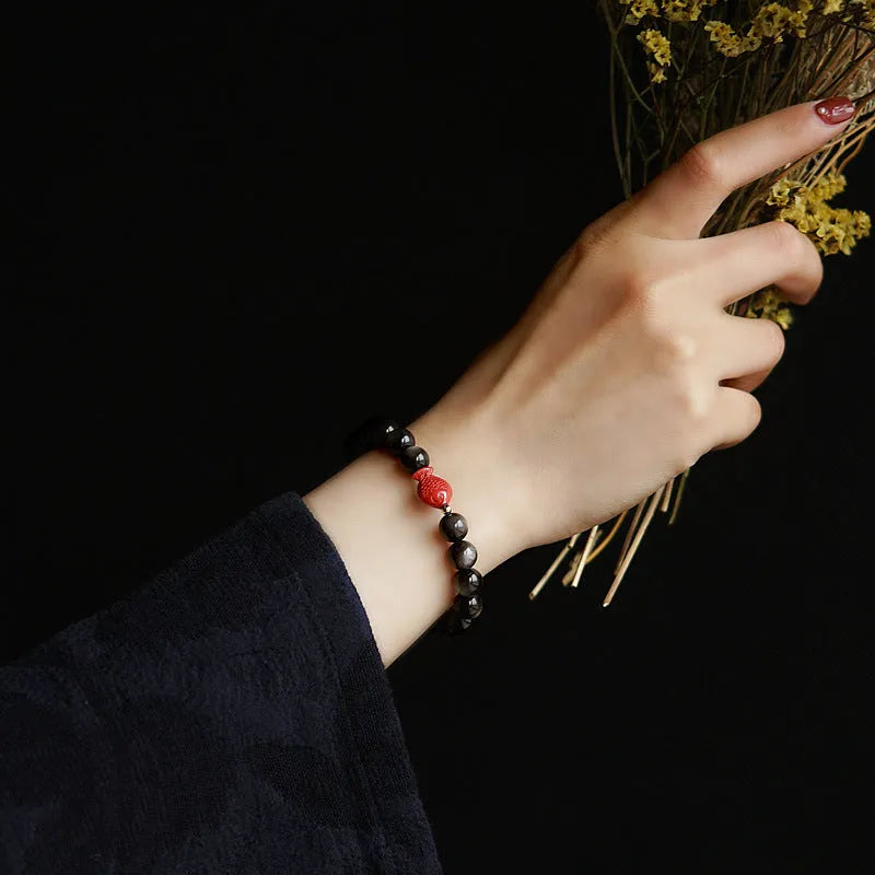 Natural obsidian bracelet with cinnabar fungal accents showing round beads in available sizes