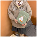 Blue cotton tablet case with embroidered cartoon duck design and a silver zipper.