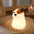 Fashion silicone puppy dog pat night light with built-in battery and Type-C charging on a table