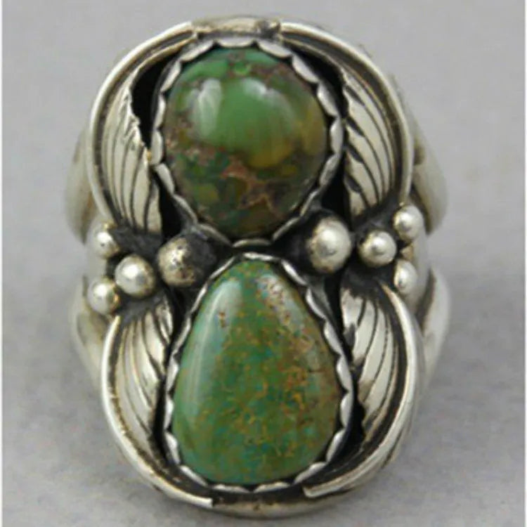 Women's geometric turquoise alloy ring with a retro inlaid design, shown on a finger.