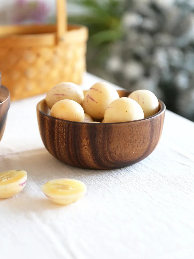 Natural brown wooden bowl with wood grain, overglaze finish, 12x6cm, on a table