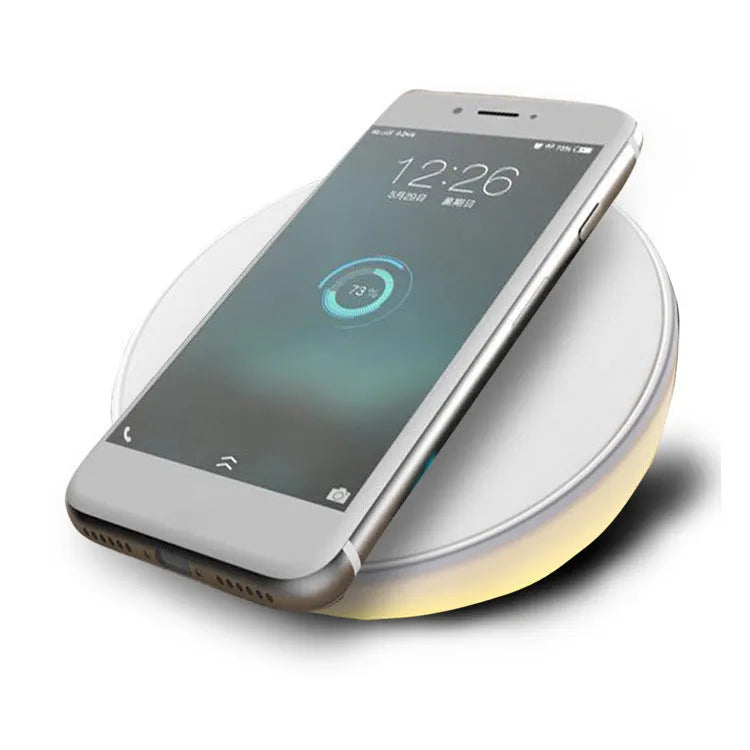 White wireless charging pad with digital clock display and control buttons for smartphone charging