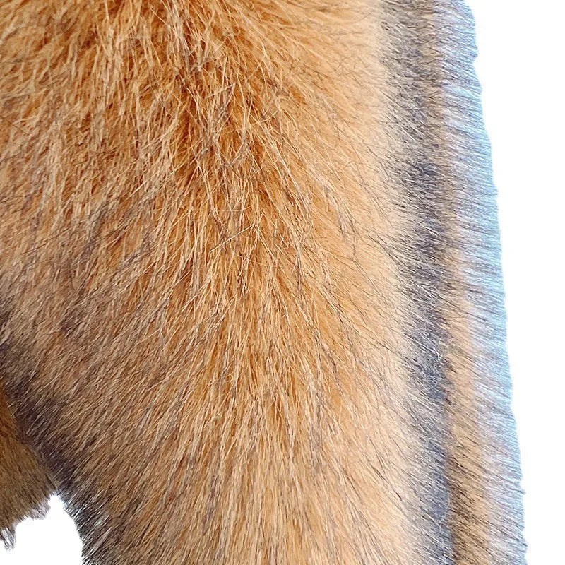 Women's loose-fitting silver grey artificial fur mid-length coat on a hanger.