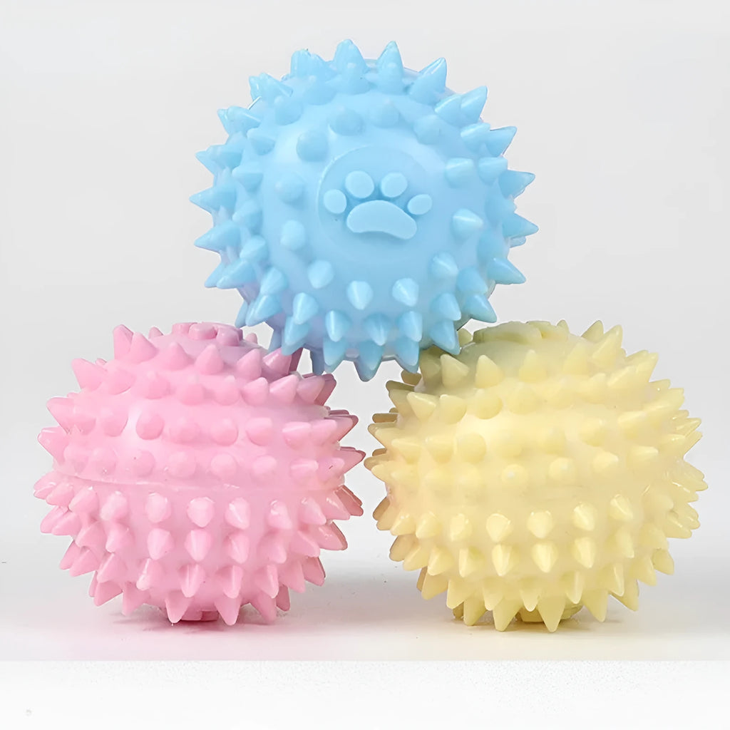 Blue TPR dog chew ball with textured footprint pattern and tooth cleaning nubs
