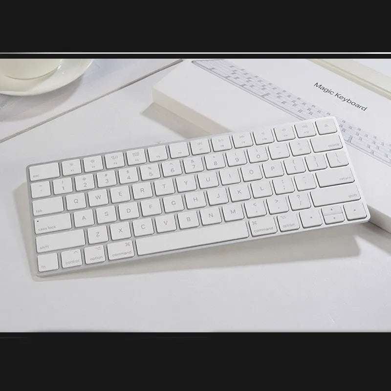 Brand new white Apple Bluetooth G6 wireless keyboard with multimedia keys in metal box.