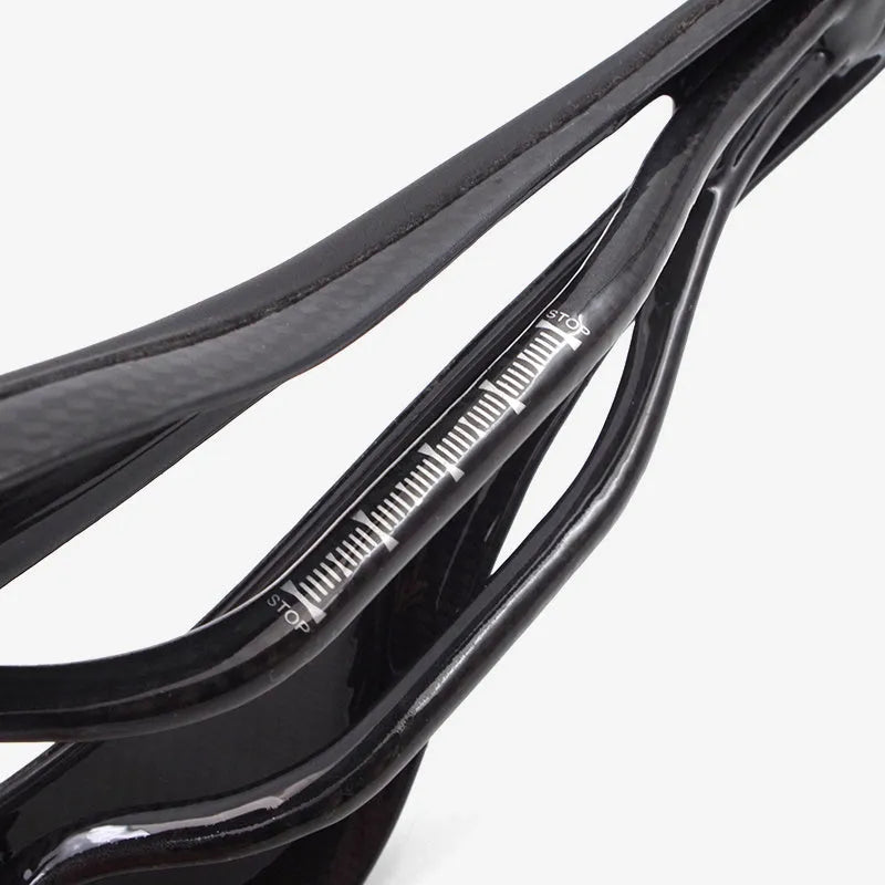 Carbon fibre bicycle saddle 272mm by 146mm in glossy black finish with standard rails