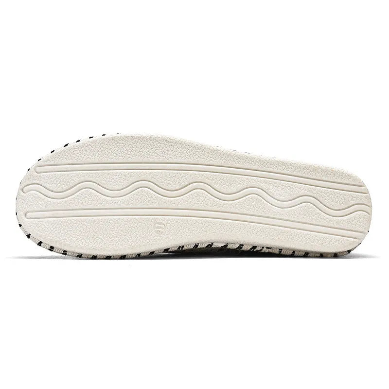 Men's summer casual shoes in beige and black with cloth uppers and slip-on design