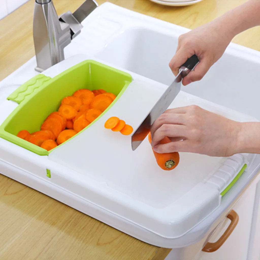 Green multi-function cutting board with draining holes mounted on kitchen sink for vegetable preparation