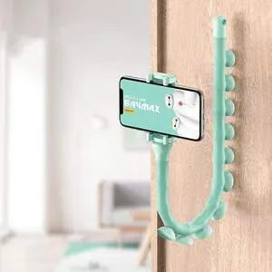 Black flexible lazy bracket mobile phone holder with long arm and suction cup base on a desktop