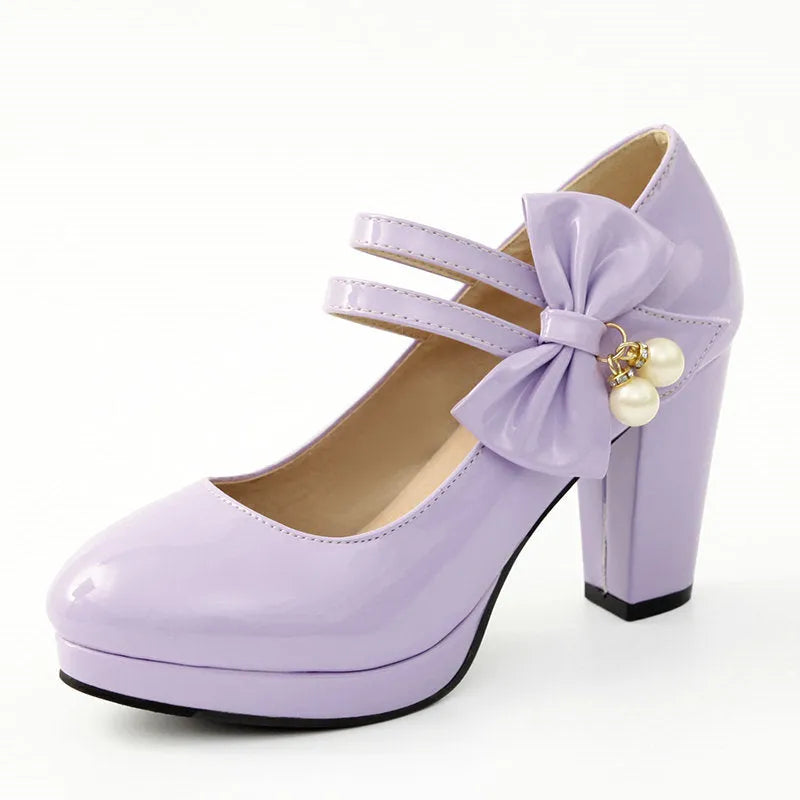 Women's red chunky heel platform shoes with round toe and buckle fastening on a rubber sole.