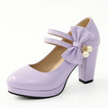 Women's red chunky heel platform shoes with round toe and buckle fastening on a rubber sole.