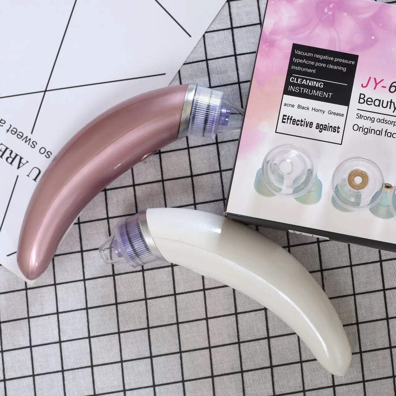 Electric blackhead suction instrument pore cleanser in rose gold or white colour for facial extraction