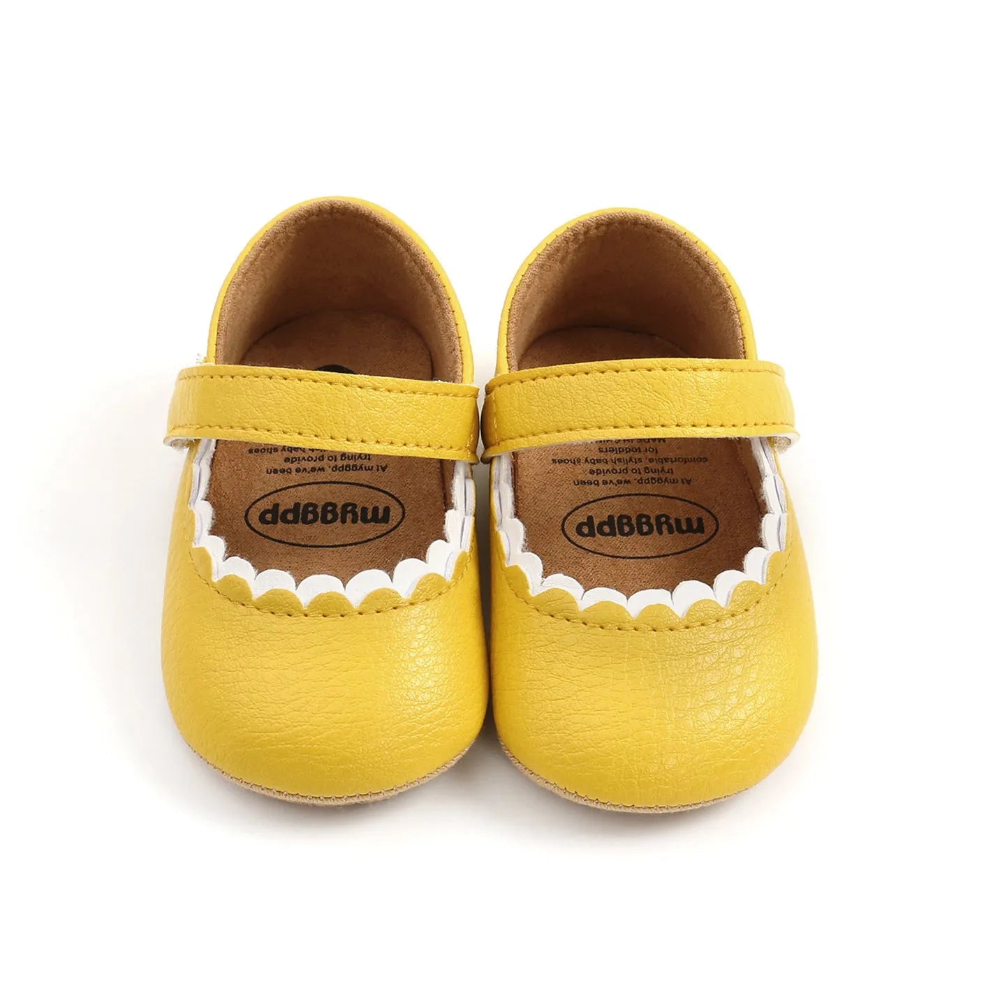Baby girl's white velcro fastening shoes with low tube height, shown on a size chart.