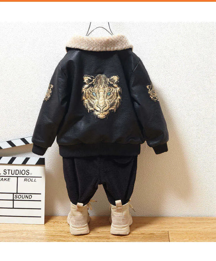 Black PU leather long-sleeved plus velvet jacket for boys with lapel collar and zipper closure, flat lay view