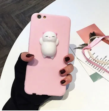 Soft pink TPU silicone iPhone case with a raised 3D cartoon cat design on the back.
