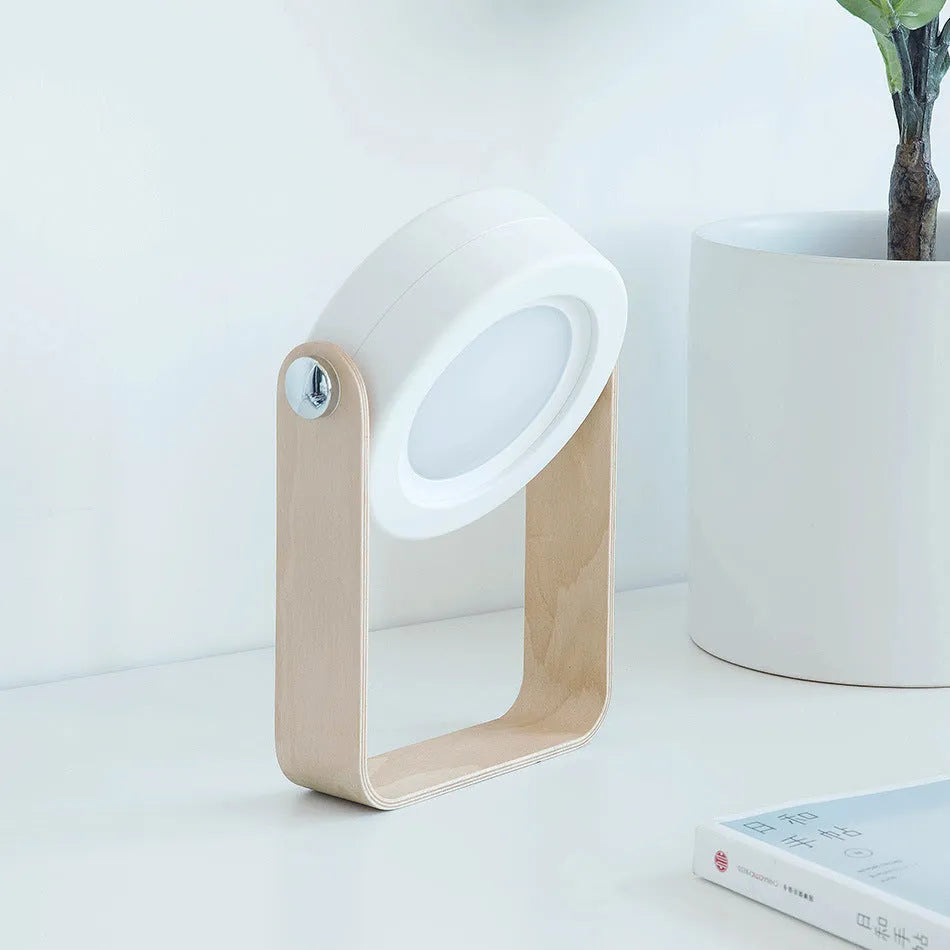 Foldable touch dimmable LED night light in white, shown in both table lamp and unfolded lantern modes.