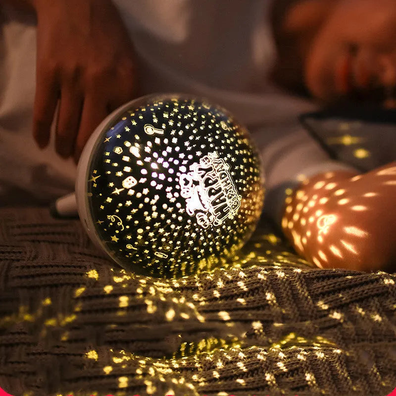 Black and white rotating starlight projection lamp showing starry sky light effect on wall