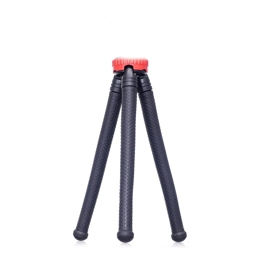 Black octopus tripod with spherical gimbal head wrapped around pole supporting mobile phone