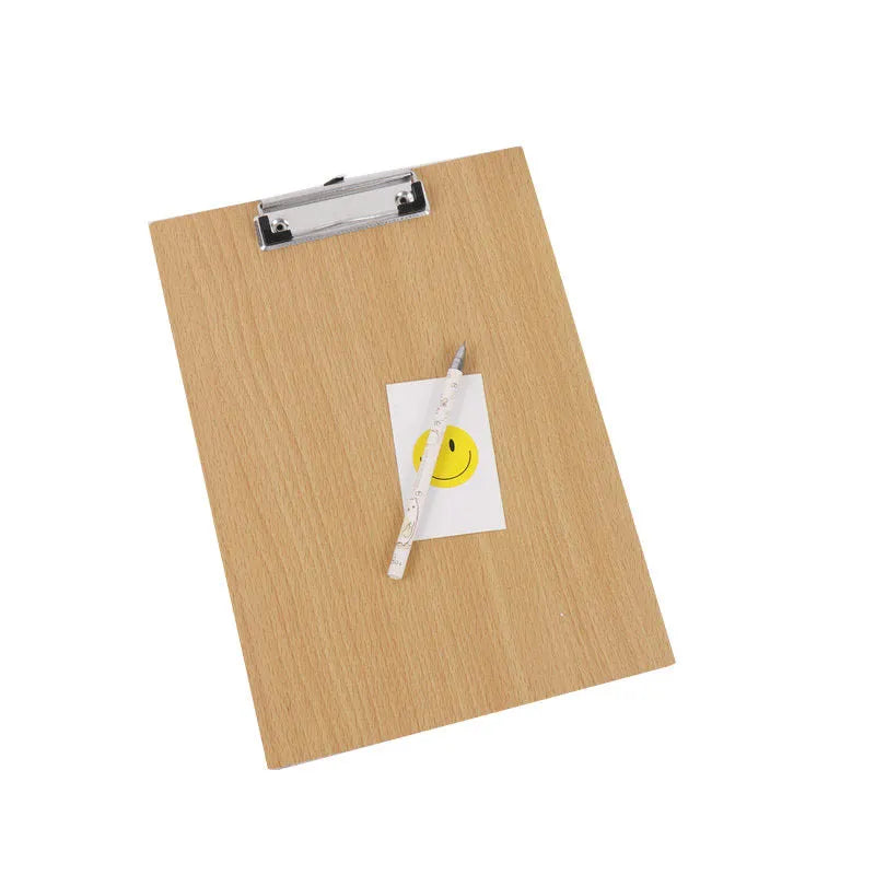 A4 wooden clipboard with metal clip and hanging hole placed on a desk