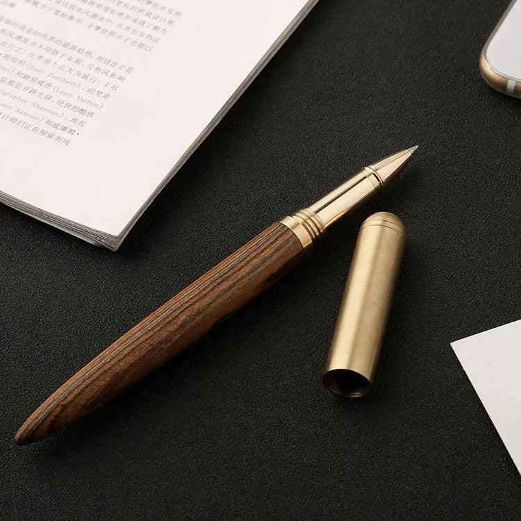 Solid wood and brass signature pen showing choice of ebony, rosewood, sandalwood, tiger skin wood, and wingwood finishes.