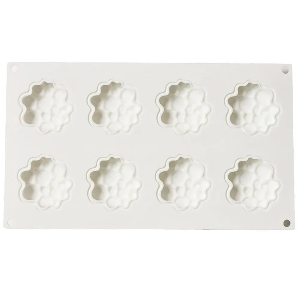 Round silicone baking mould with 8-bubble patterned base for cakes and desserts.
