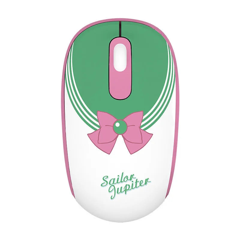 Pink Sailor Moon cartoon wireless mouse on a desk next to a laptop.