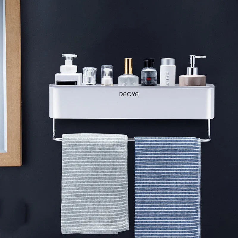 Plastic bathroom wall shelf with hole-free installation, shown holding shampoo and shower gel bottles.
