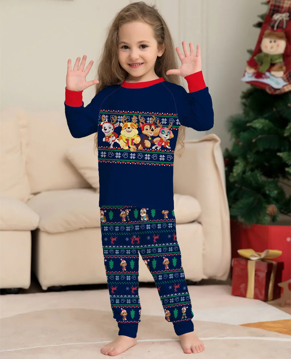 Matching family wearing red plaid Christmas deer print cotton pyjamas, including adults, children, and a dog.