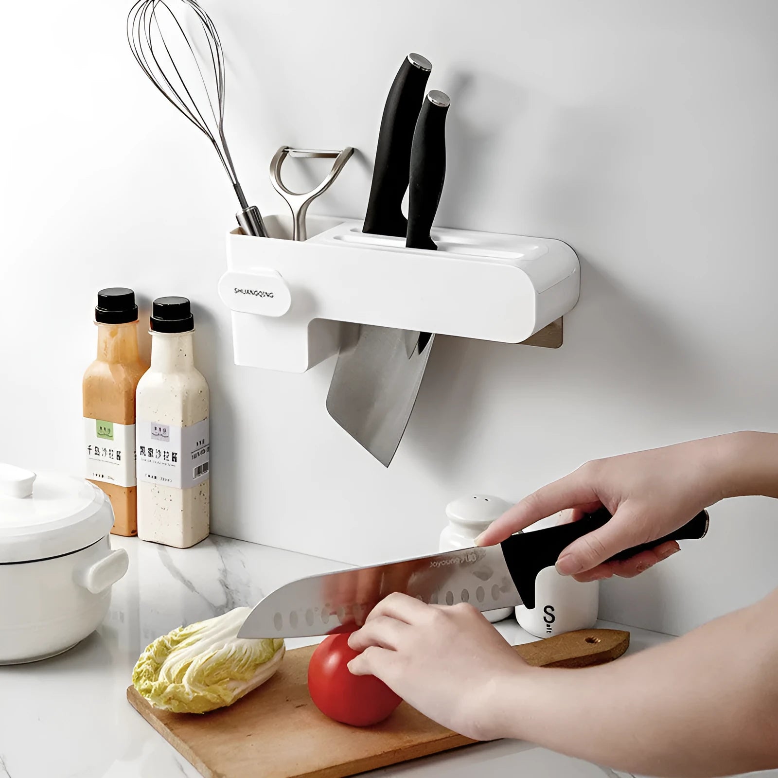 White plastic knife rack on kitchen countertop showing modern simple design