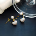 Heart-shaped alloy stud earrings with electroplated finish and artificial gemstones in Korean style