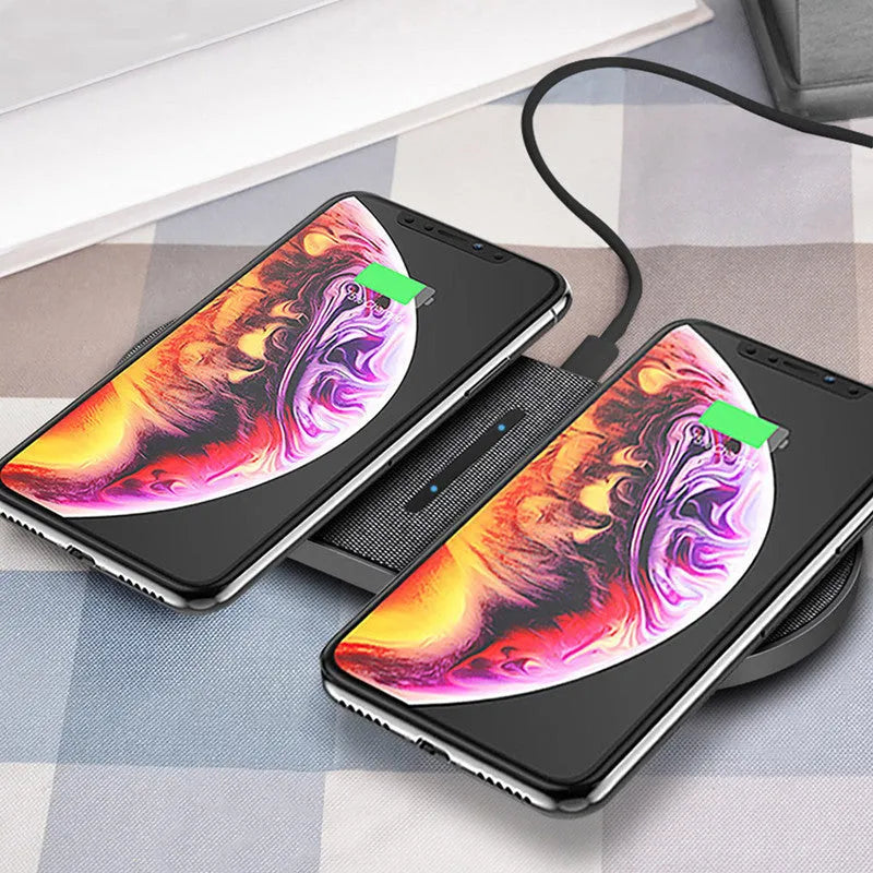 Black dual wireless charging pad with two device charging areas and LED indicator light
