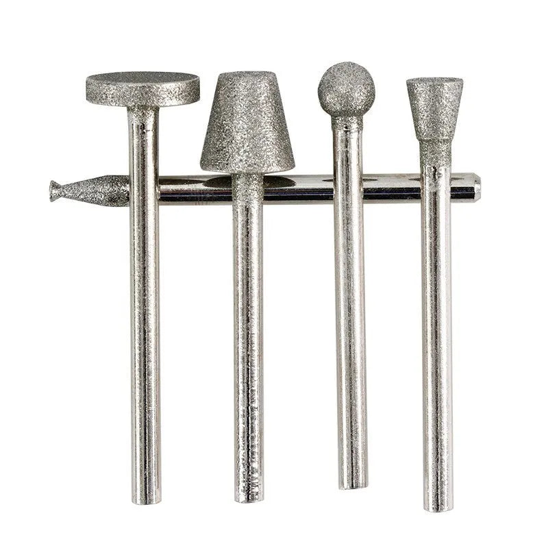 Set of gold-coloured alloy grinding heads with elliptical cone shapes and 3mm shanks