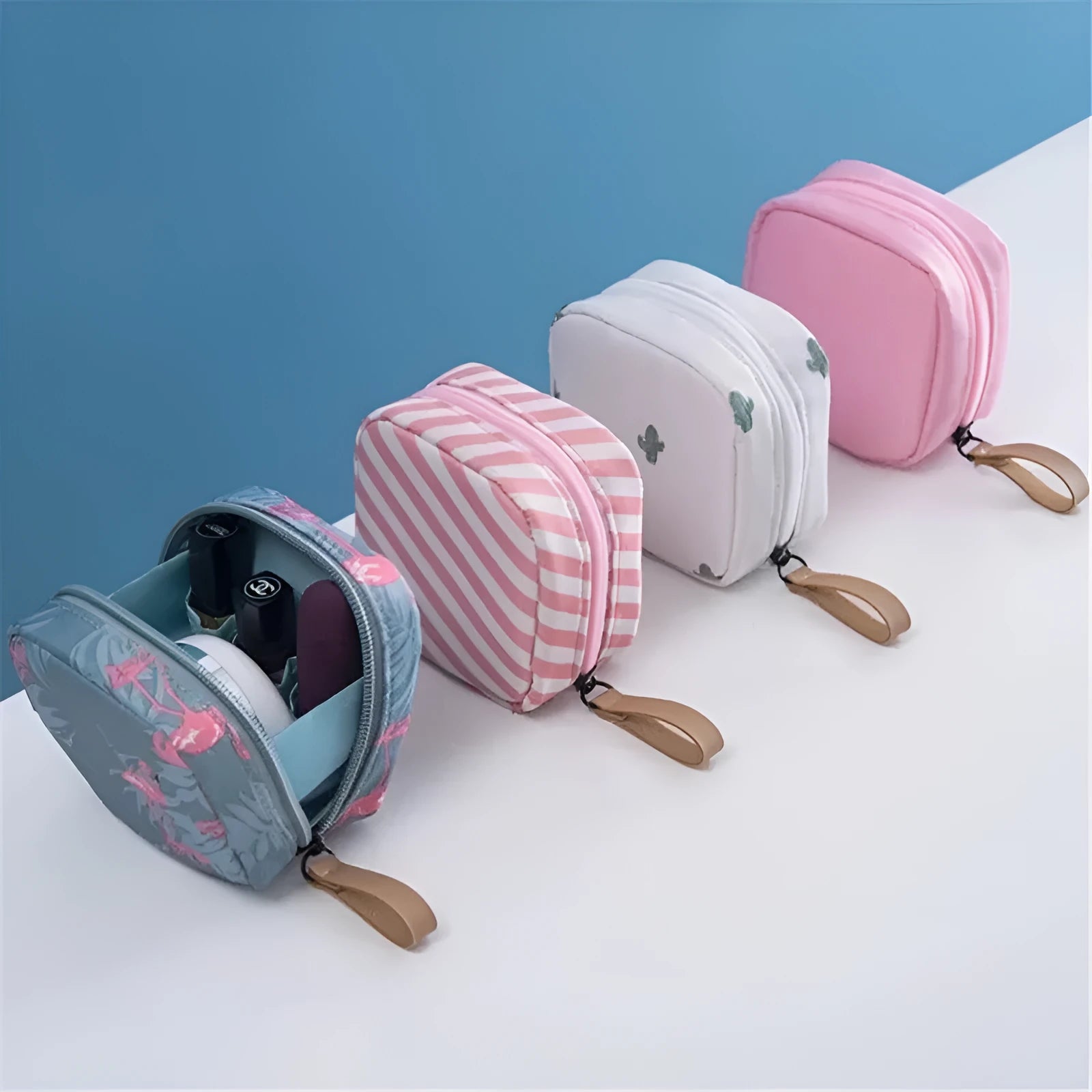 A blue cube-shaped cloth makeup storage bag sitting on a surface, open to show interior space.
