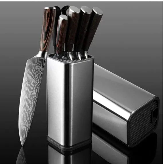 Black and white kitchen knife holder with storage bucket and optional cutting board on a countertop.
