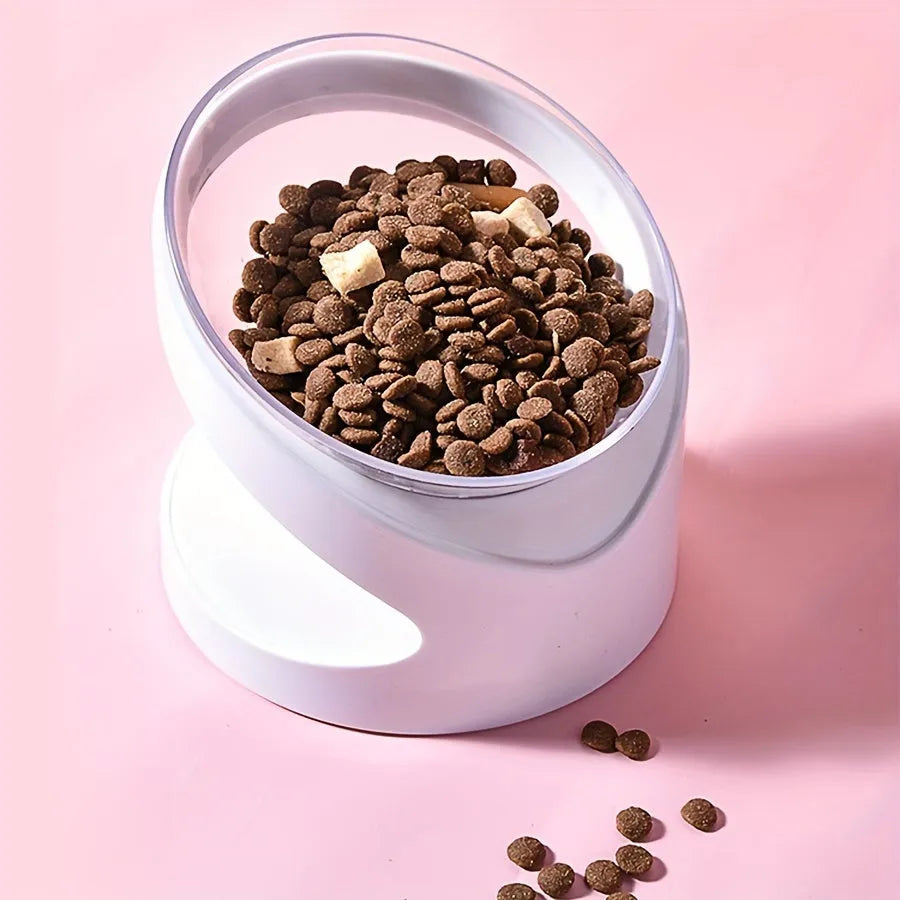 White elevated cat food bowl with a tilted surface on a raised platform.