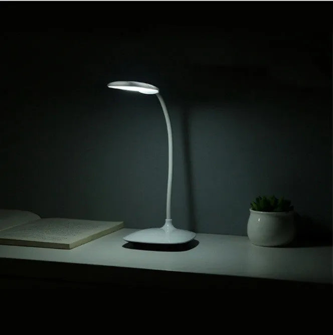 White LED desk lamp with USB charging cable, touch switch, and ABS shade on a desk
