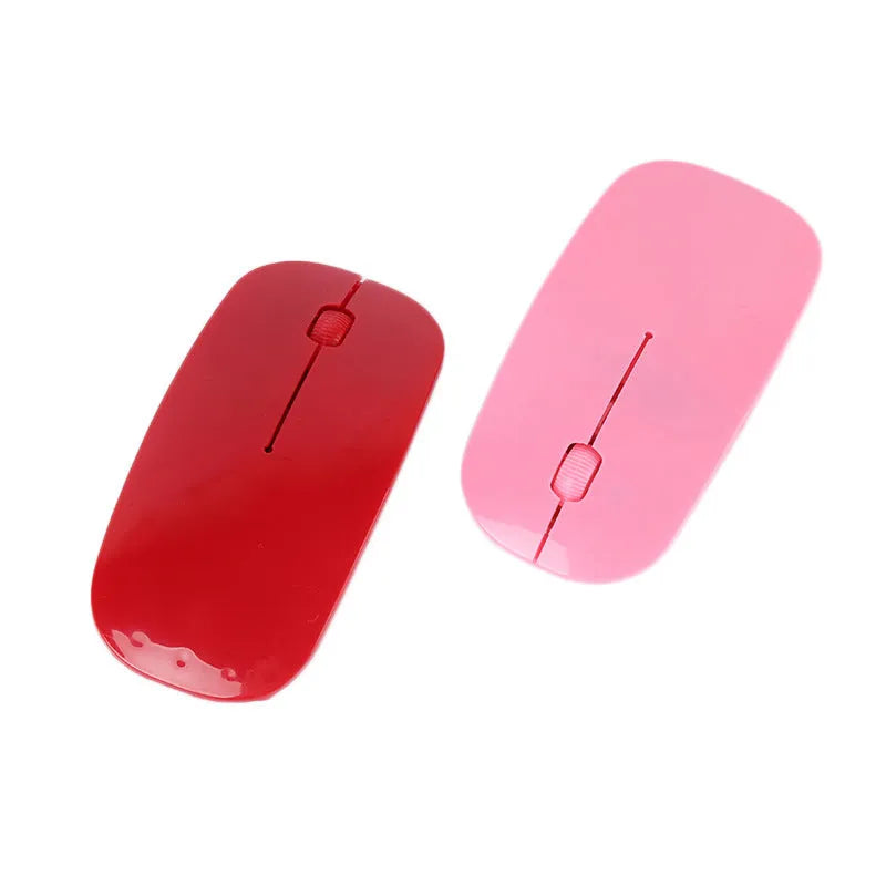 Ultra-thin wireless computer mouse shown in multiple colour options: black, blue, green, pink, red, and white.
