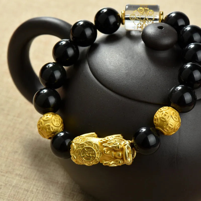 Natural obsidian temperature-sensitive colour change bracelet with gold accents and Pi Xiu motif