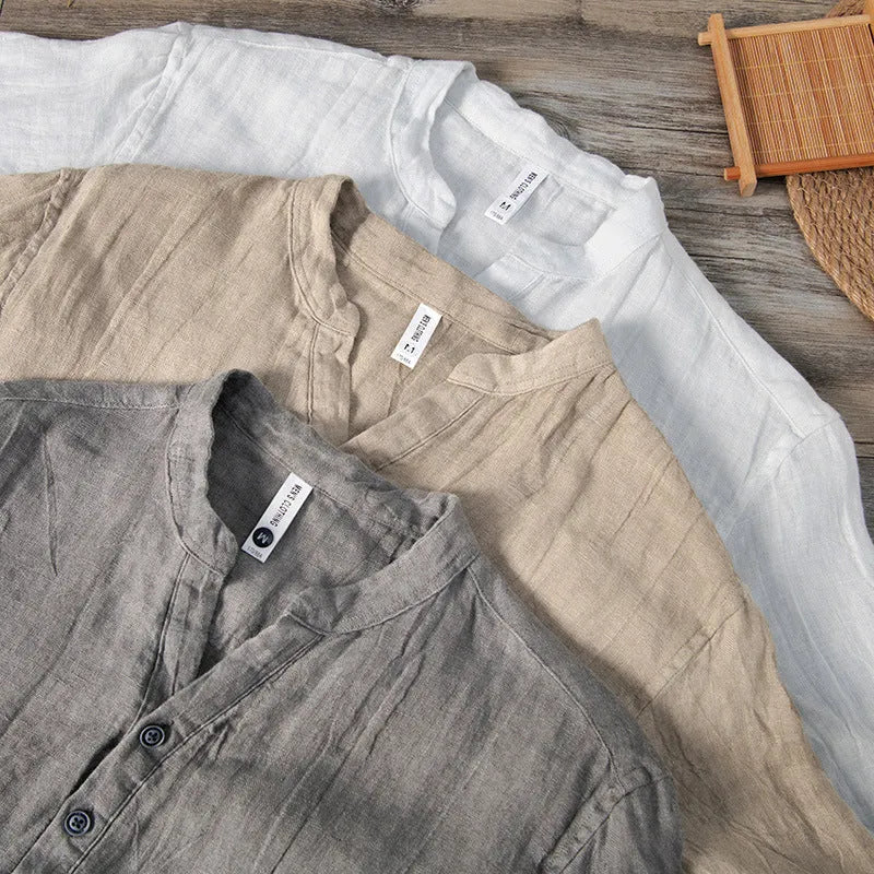 Retro-style linen pullover top in a solid colour with short sleeves, shown on a hanger.