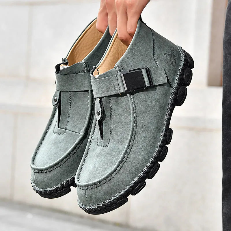 Men's black handmade stitching casual slip on shoes with flat rubber sole.