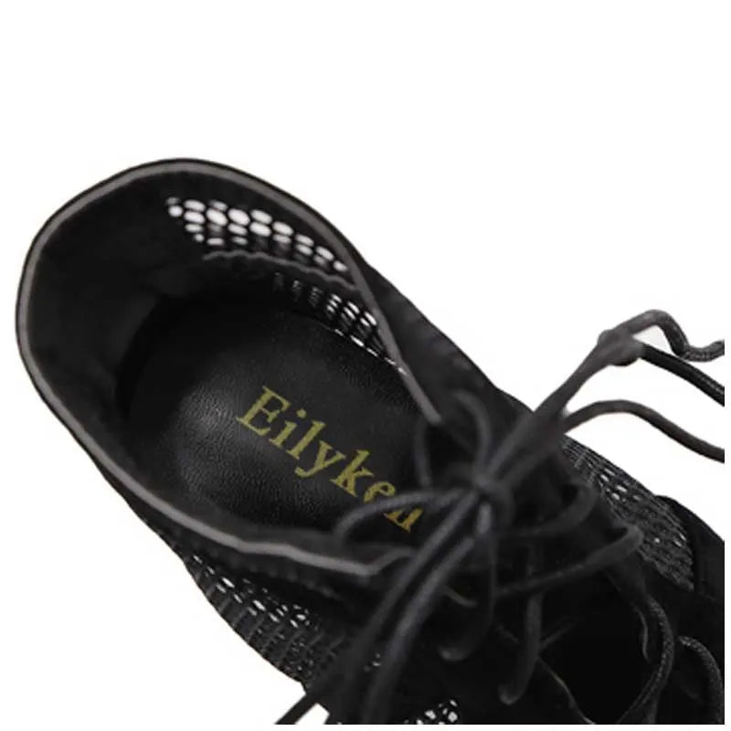 Black suede women's lace-up high heel shoes with an 11.5cm heel and 1cm platform.