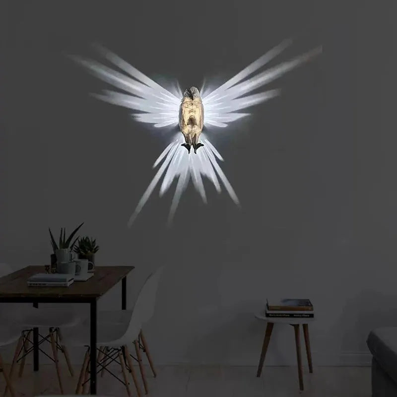Eagle-shaped 3D projector wall lamp with resin plastic construction showing light projection effects