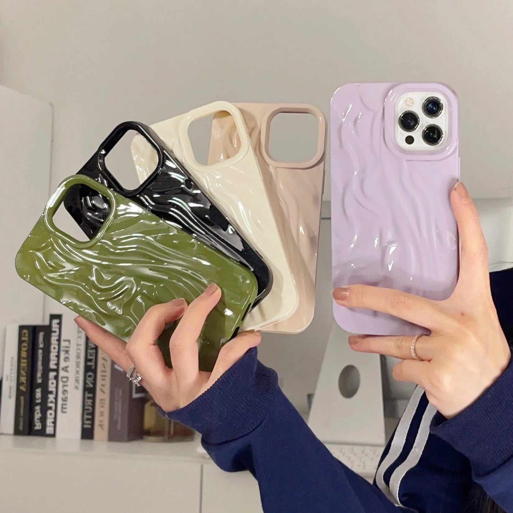 Ins-style water ripple silicone phone case for iPhone in milky white, showing textured surface.