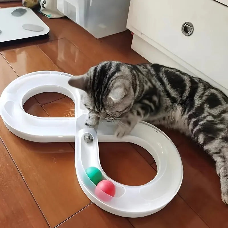 Cat toy set with turntable track ball amusement centre and teasing cat stick on blue background
