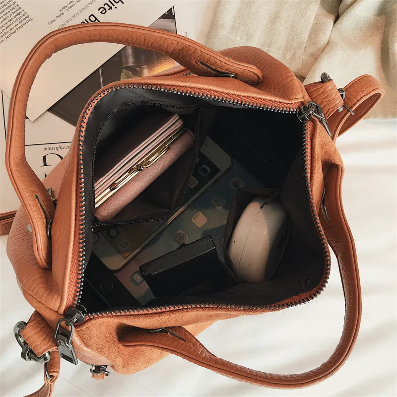 Large casual women's tote shoulder bag in soft PU leather with a zip closure.