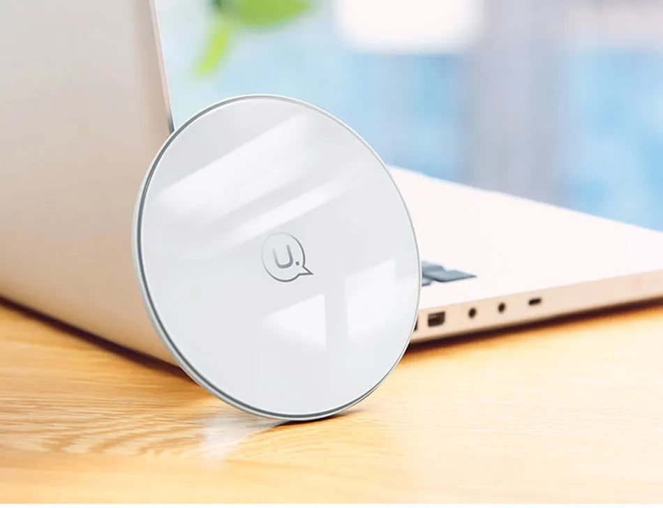 Glass disc wireless charger for smartphones in black or white with charging indicator